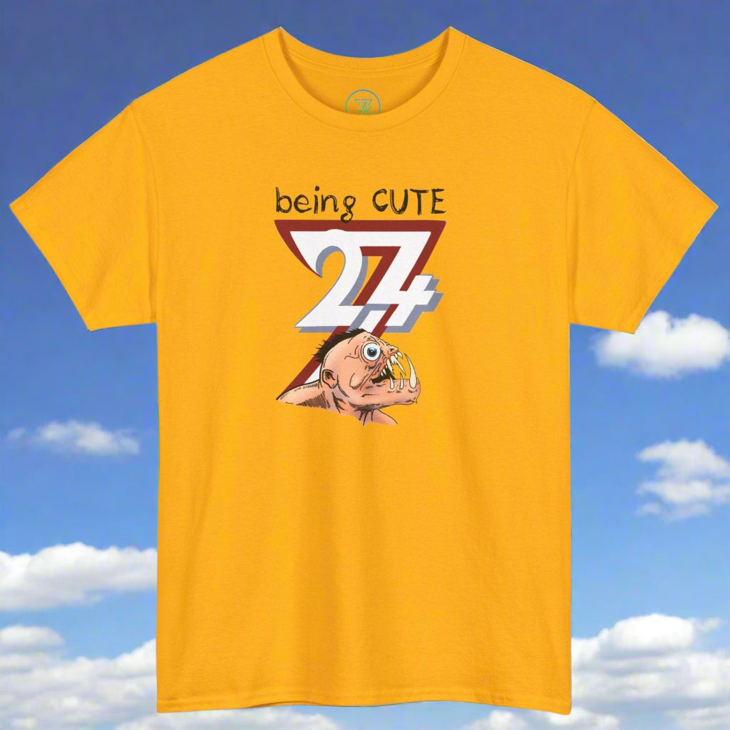 Yellow tee with funny monster face graphic and "being cute 24/7" text design
