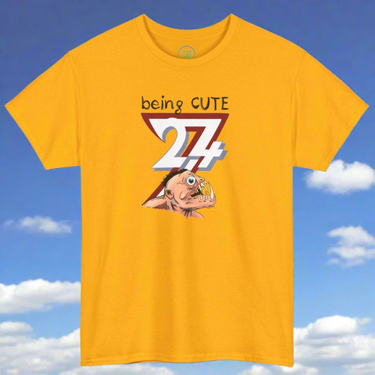 Yellow tee with funny monster face graphic and "being cute 24/7" text design