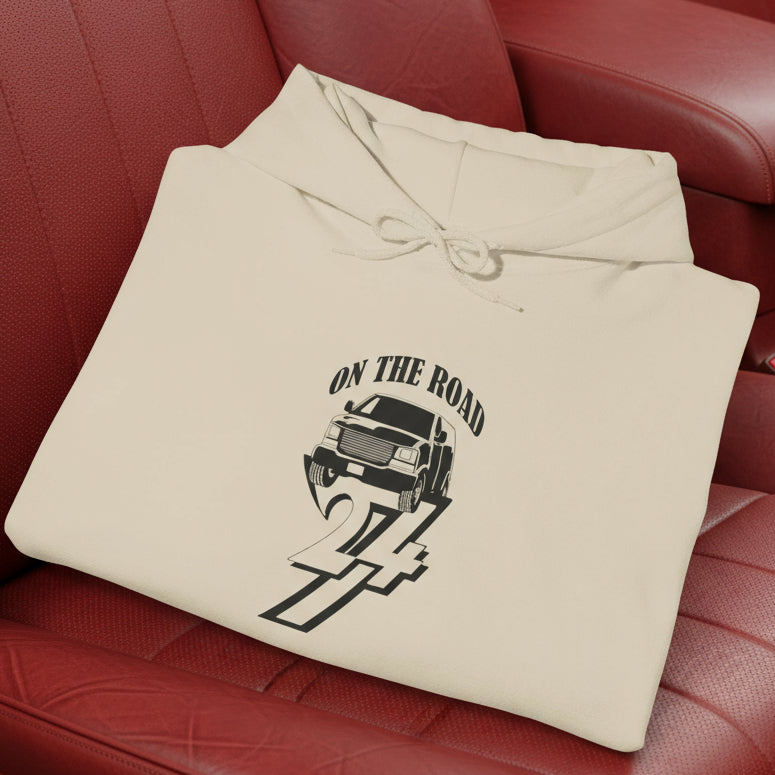 beige car hoodie with hand-drawn vehicle design and "ON THE ROAD 24/7" text