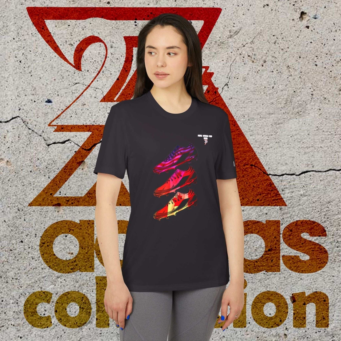 Female model in the Black 2026 World Cup Adidas shirt, highlighting the 90s-style comic linework and athletic fit.