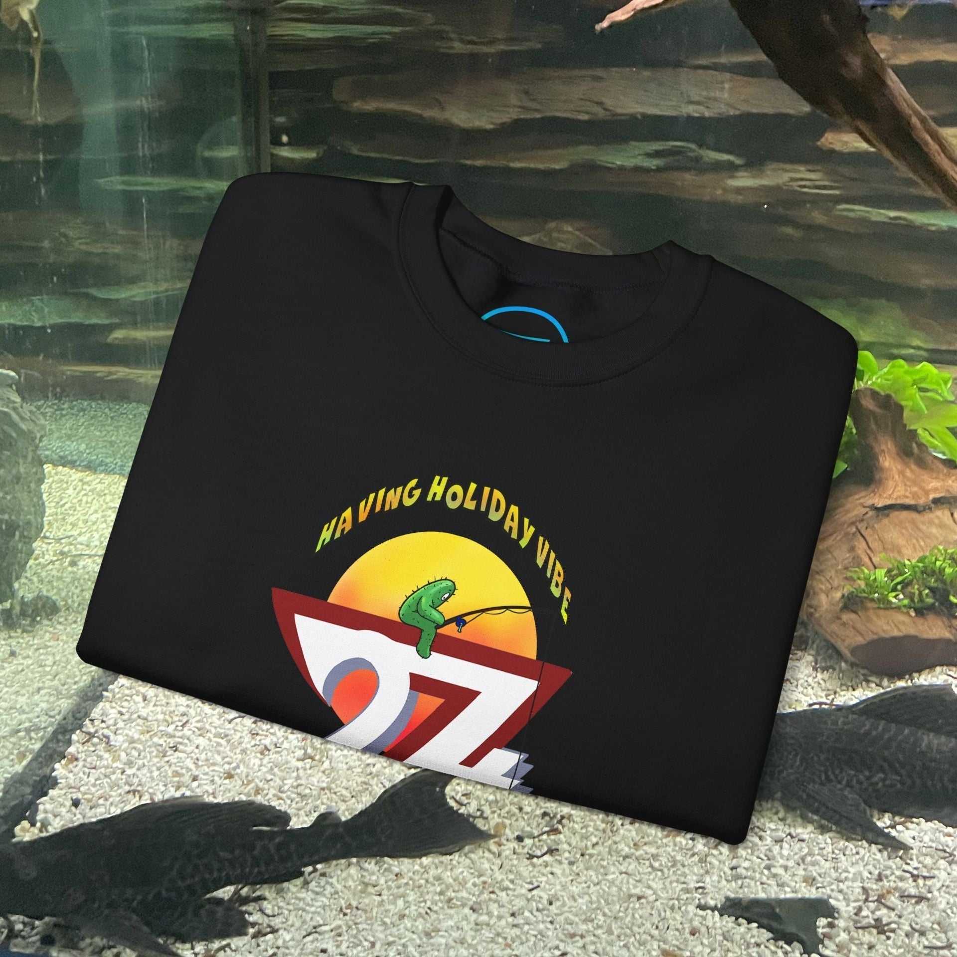 black fishing cactus sweatshirt with colorful cartoon design and "Having Holiday Vibe" text