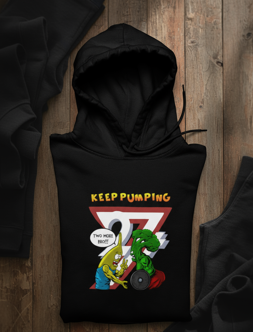 black workout hoodie with cartoon broccoli and banana lifting weights and "Keep Pumping" text design