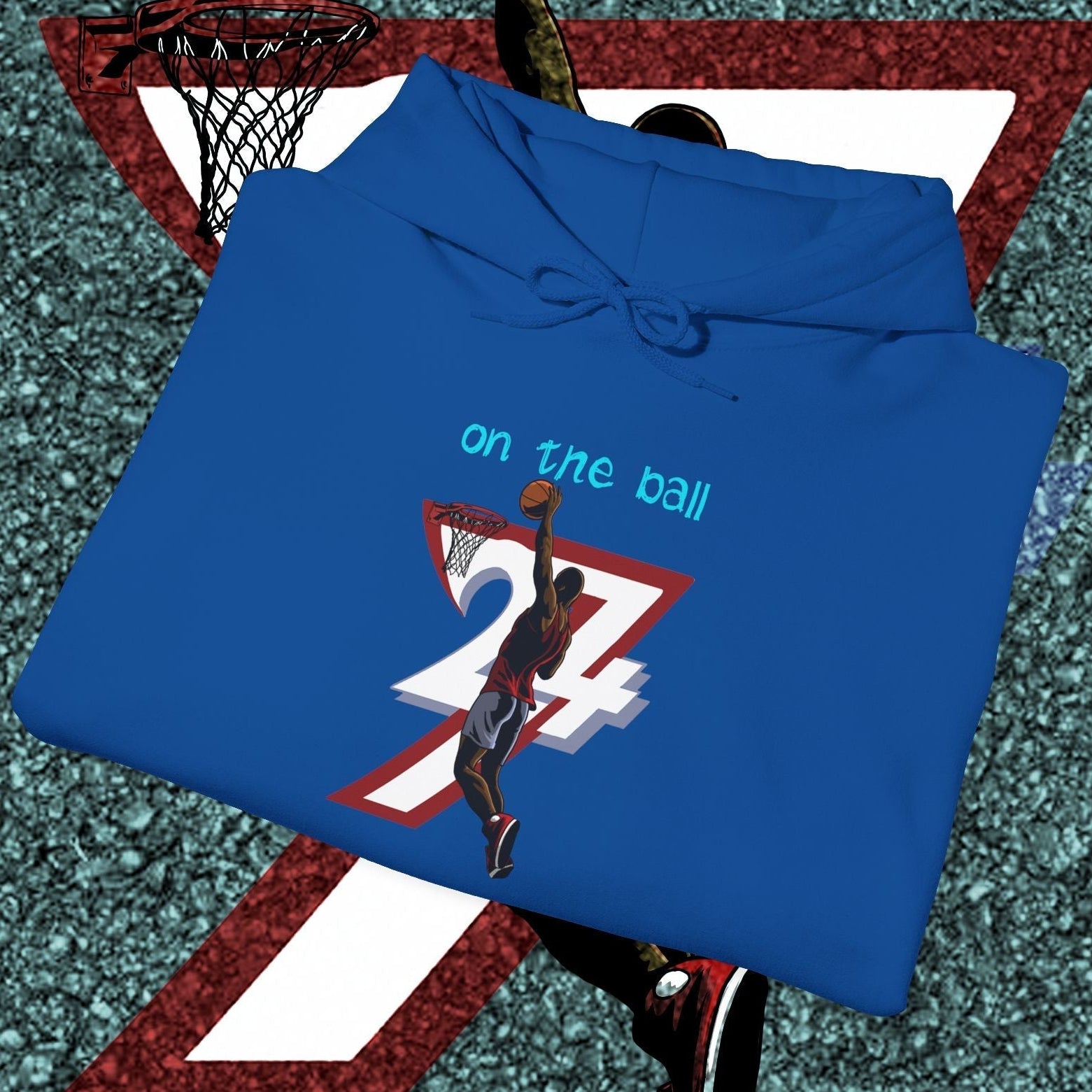 blue basketball hoodie with hand-drawn basketball player design and "on the ball" text, urban streetwear style