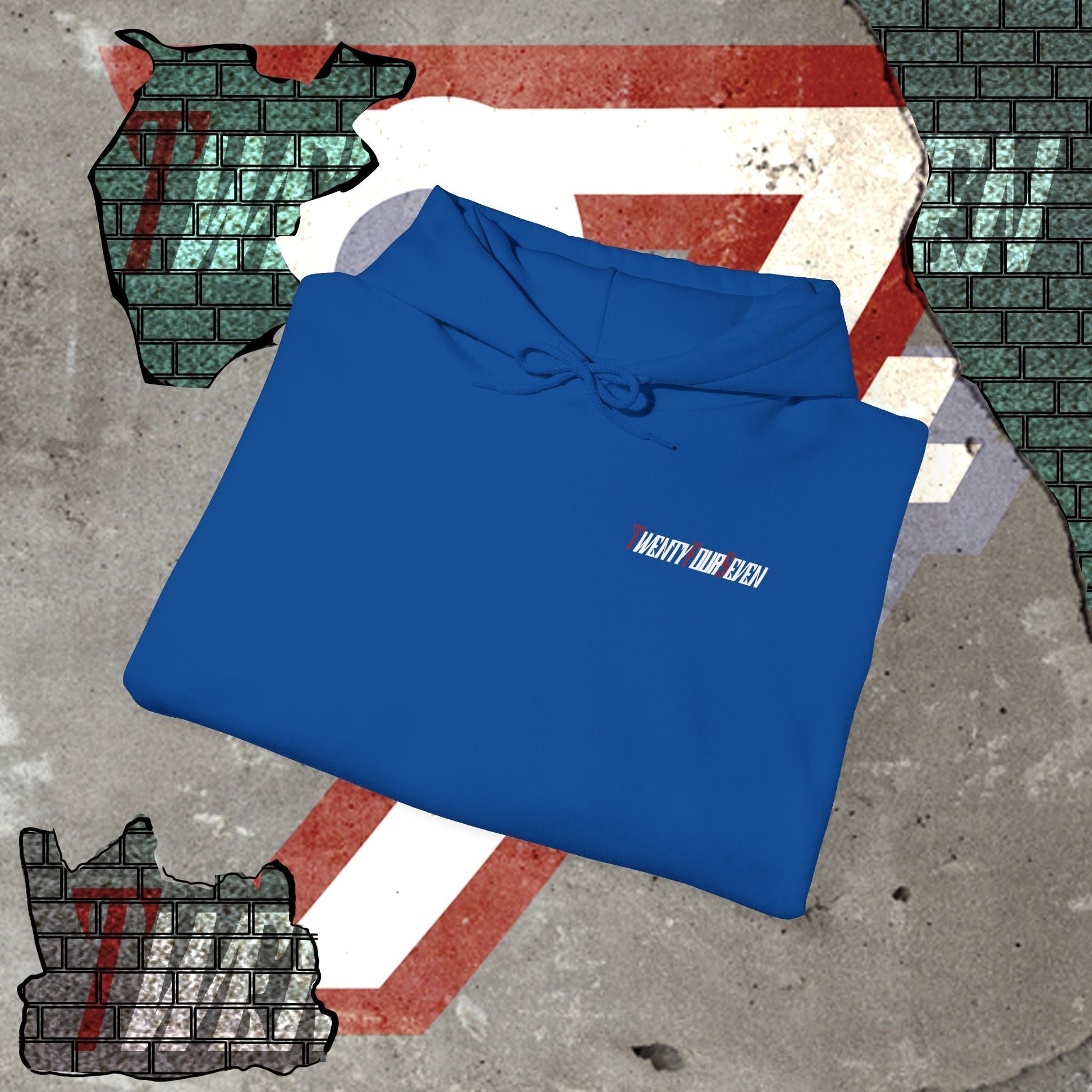blue printed hoodie with twentyfourseven logo folded on textured surface with graphic background