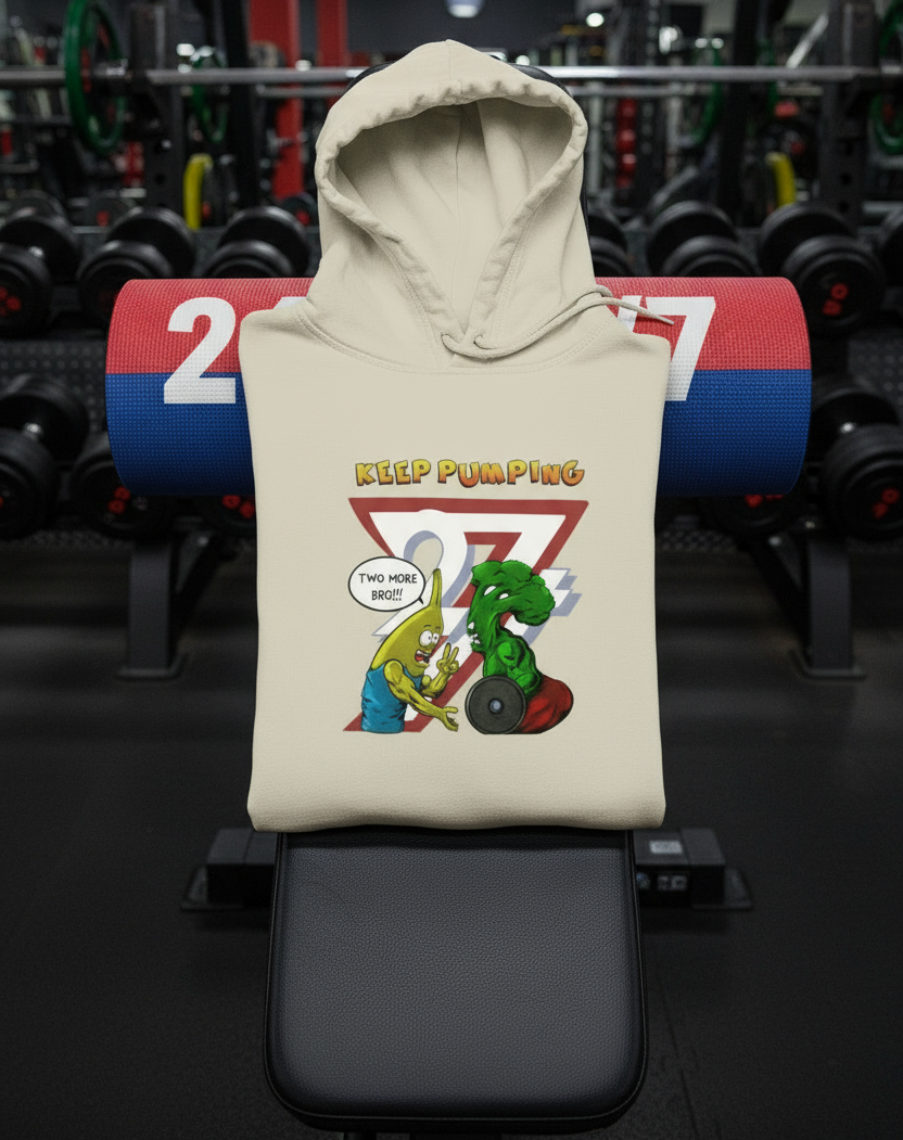 cartoon broccoli banana workout hoodie with unique training buddies illustration and "Keep Pumping" text
