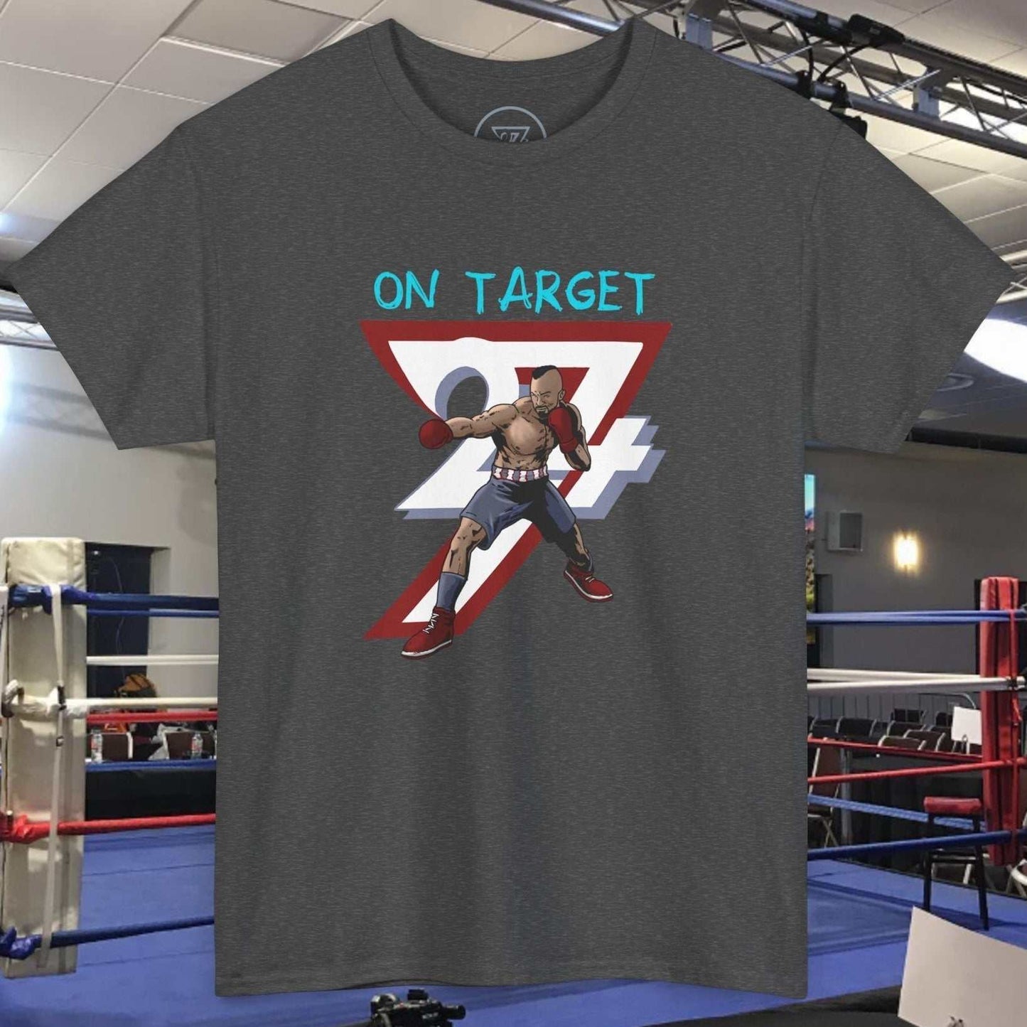 dark gray boxing tee with comic-style boxer illustration and "On Target" text, sports gym background