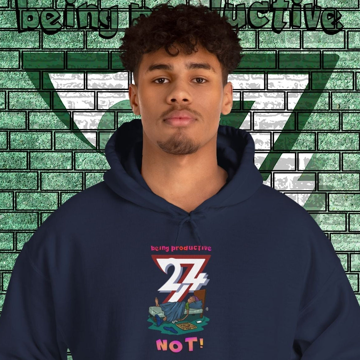 funny custom hoodie with cartoon lazy teen design in navy blue worn by male model against green brick wall background