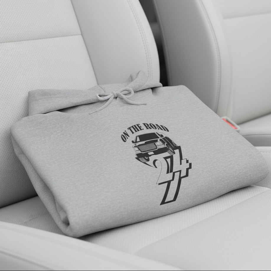 gray car hoodie with hand-drawn vehicle design and "On The Road 24/7" text, folded