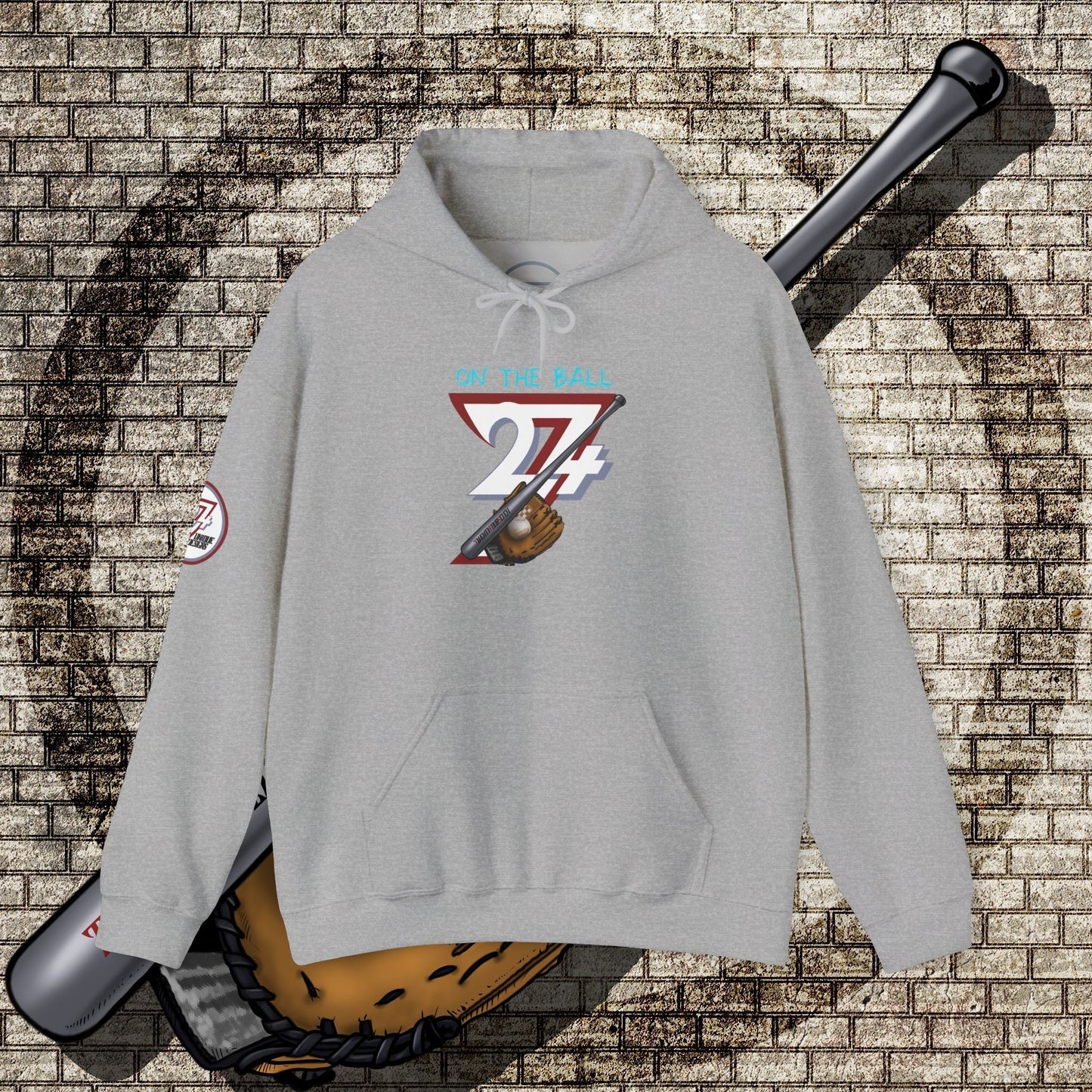 grey baseball hoodie with graphic of baseball gear and "On The Ball 24/7" text on front, kangaroo pocket and adjustable hood