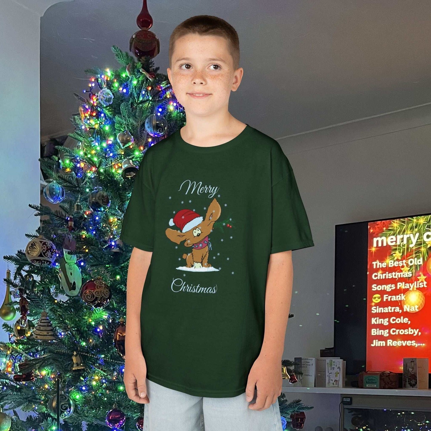 Young boy wearing the Forest Green Holiday Puppy tee, showing the durable fit and festive green tones.