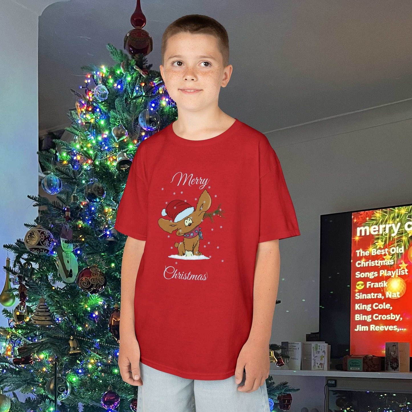Young boy wearing the Red Holiday Puppy tee, showing the durable fit and festive green tones.