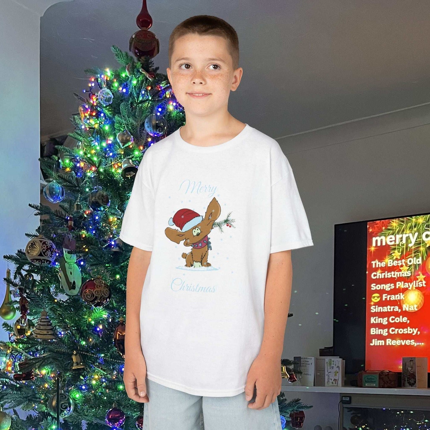Young boy wearing the White Holiday Puppy tee, showing the durable fit and festive tones.