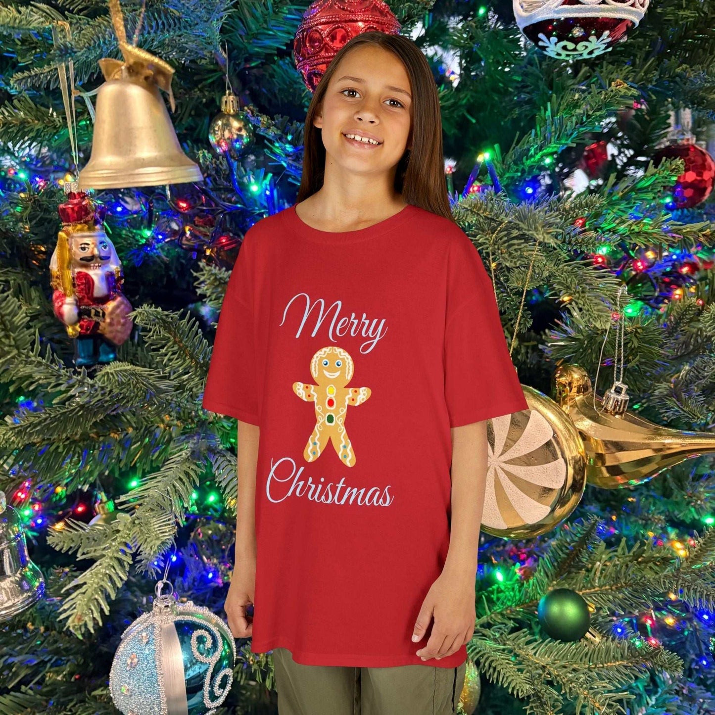 Young girl wearing the Holiday Red Gingerbread shirt, showcasing the soft fabric and bright festive color.