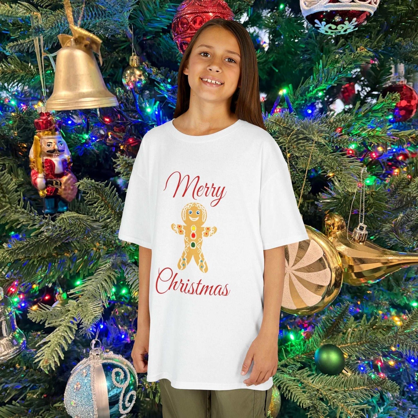 Young girl wearing the Holiday White Gingerbread shirt, showcasing the soft fabric and bright festive color.