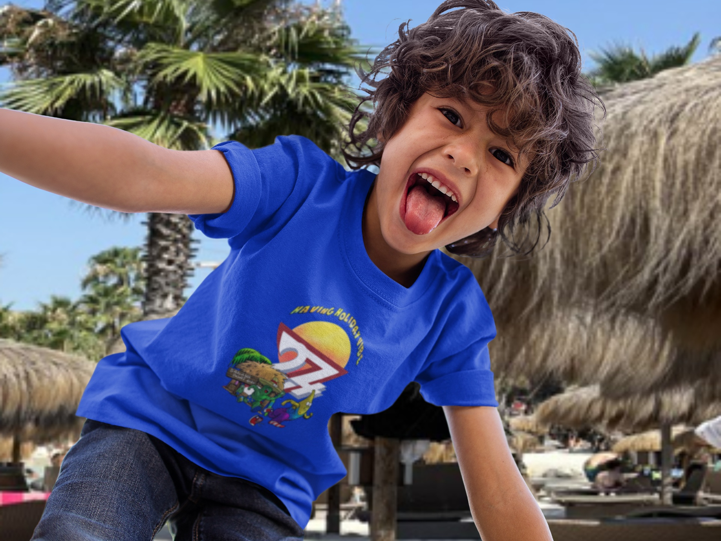 Young boy wearing the Royal Blue Kids Tropical Vacation T-Shirt featuring Leonando chasing Banana Bundy.