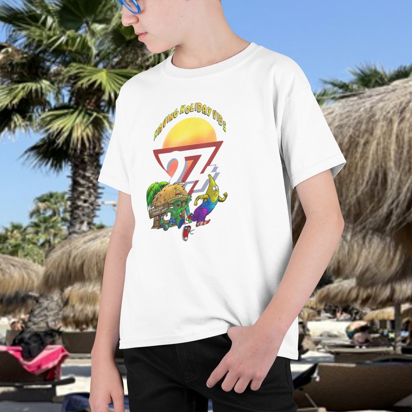 Young boy wearing the White Kids Tropical Vacation T-Shirt featuring Leonando chasing Banana Bundy.