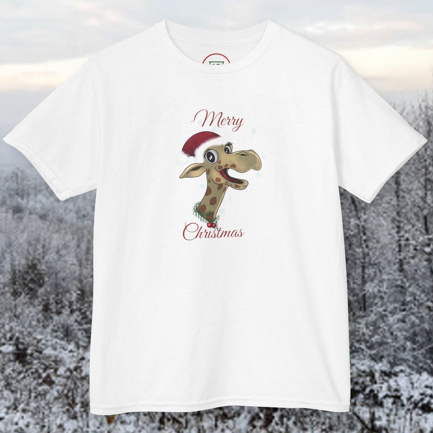 Front view of the Kids White Christmas Giraffe tee featuring a hand-drawn giraffe in a holiday hat on 100% premium ring-spun cotton.