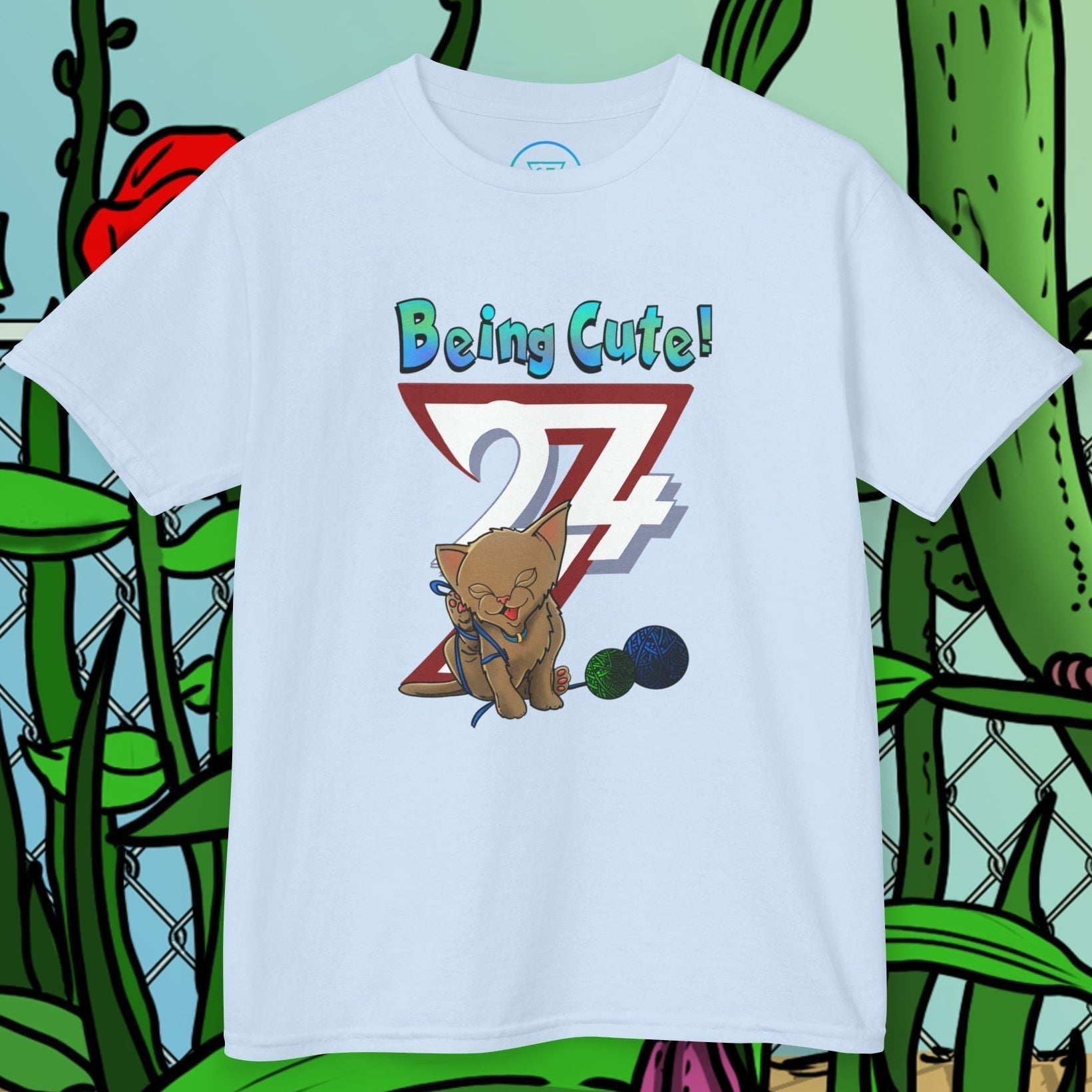 light  blue kids cat t-shirt with hand-drawn cute kitten and "Being Cute!" text design
