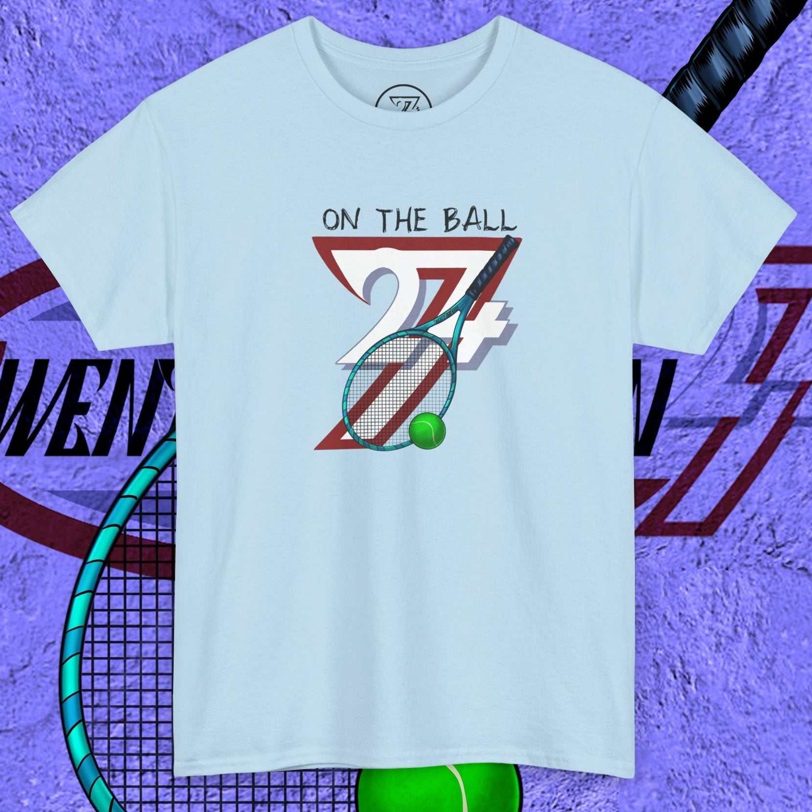 light blue tennis tee with hand-drawn "On the Ball 24/7" graphic and tennis racquet illustration