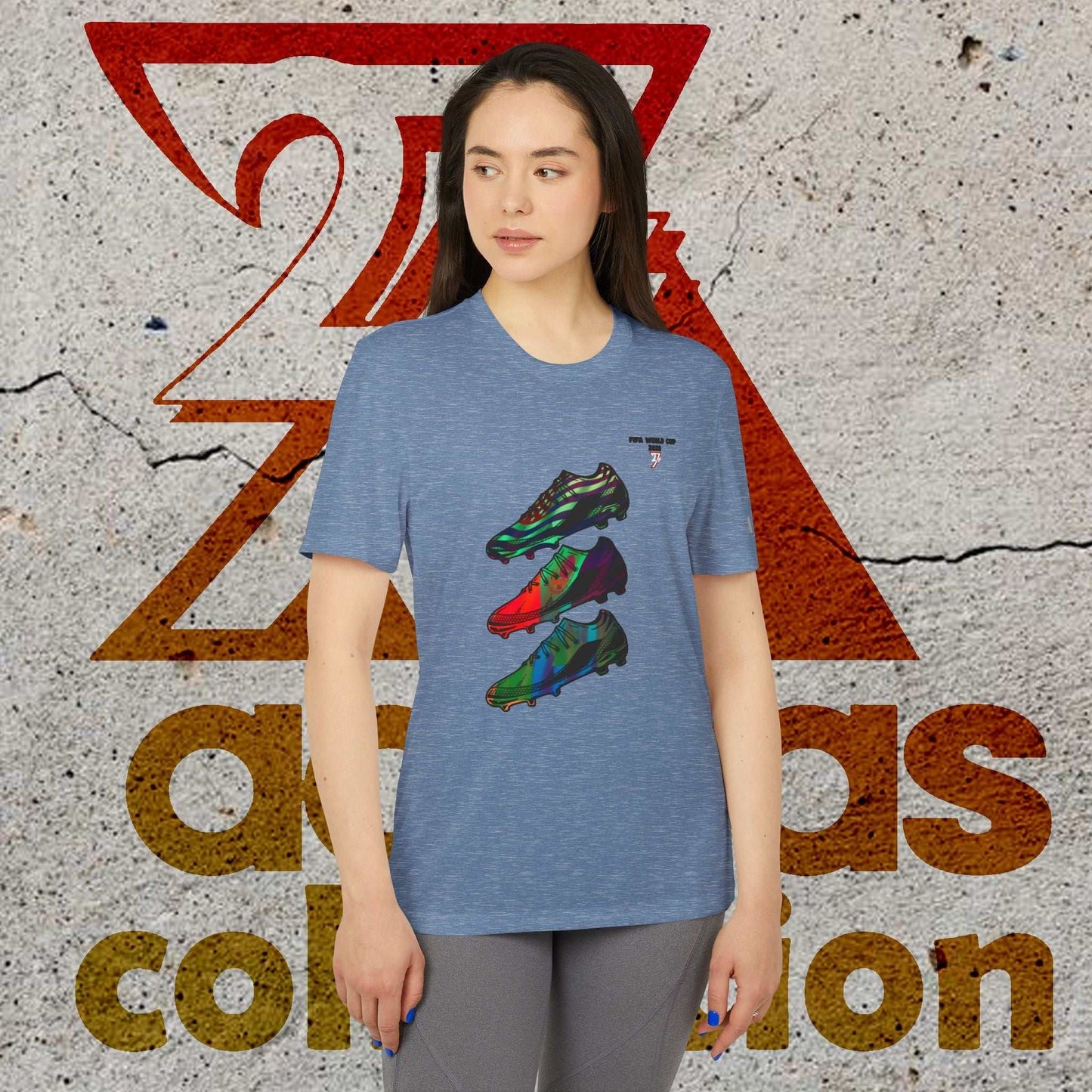 Female model in the Navy 2026 World Cup Adidas shirt, showing the 90s comic-style artist design and athletic fit.