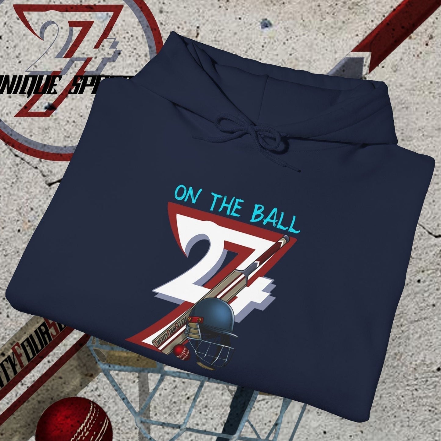 navy blue cricket hoodie sweatshirt with unique "24/7 on the ball" illustration, cricket bat, ball, and helmet background, sports apparel for outdoor lovers