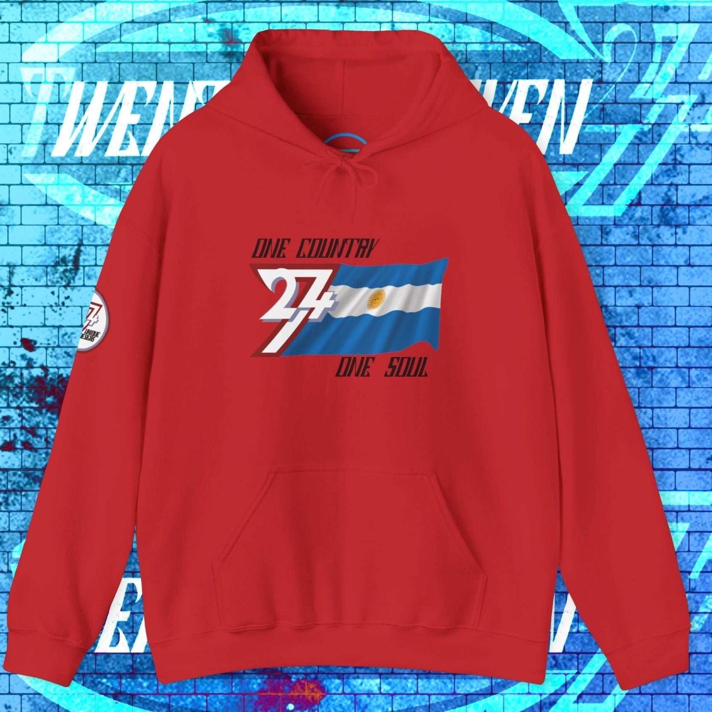 Red Argentina pride hoodie with signature hand-drawn sun icon and 24/7 trademark branding.