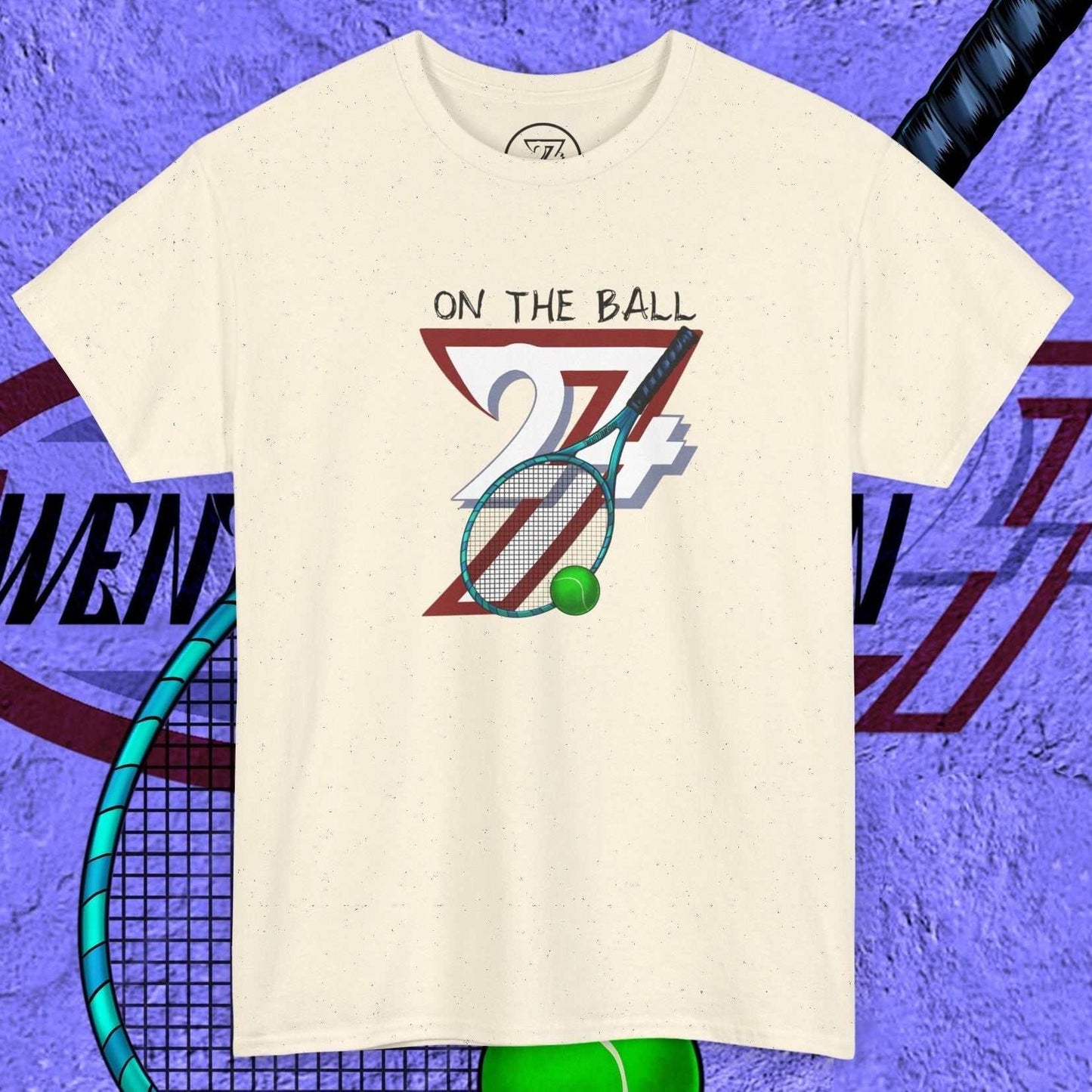 tennis tee with hand-drawn "On the Ball 24/7" graphic featuring a racket and ball on a cream background
