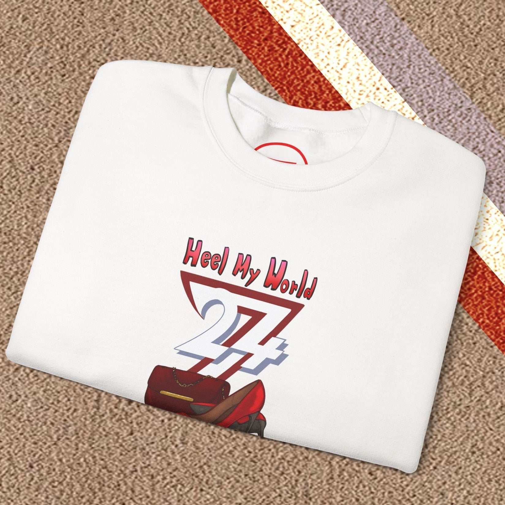 white graphic sweatshirt for women with handbag and high-heel design folded on carpet