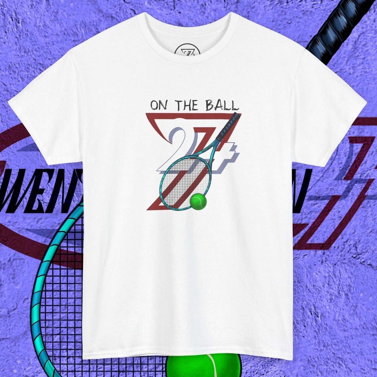 white tennis tee with hand-drawn "On the Ball 24/7" design featuring tennis racket and ball
