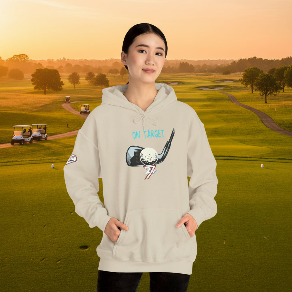 woman wearing beige golf hoodie with hand-drawn golf club and ball design and kangaroo pocket