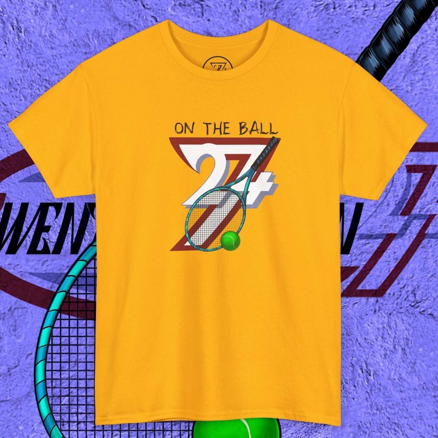yellow tennis tee with hand-drawn "On the Ball 24/7" graphic and tennis racquet design